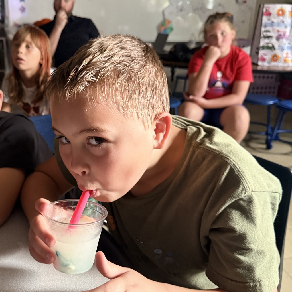 Pictures of 3rd grade students drinking slushies to celebrate doing a great job on MAP testing