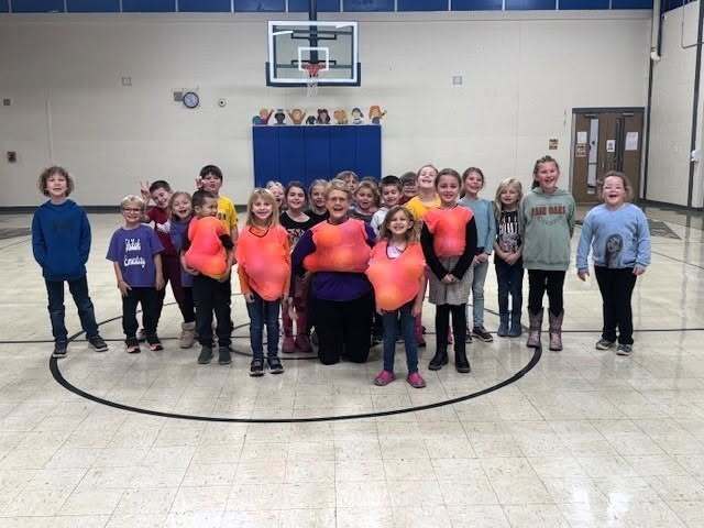 Ms. Sisk with an elementary PE class