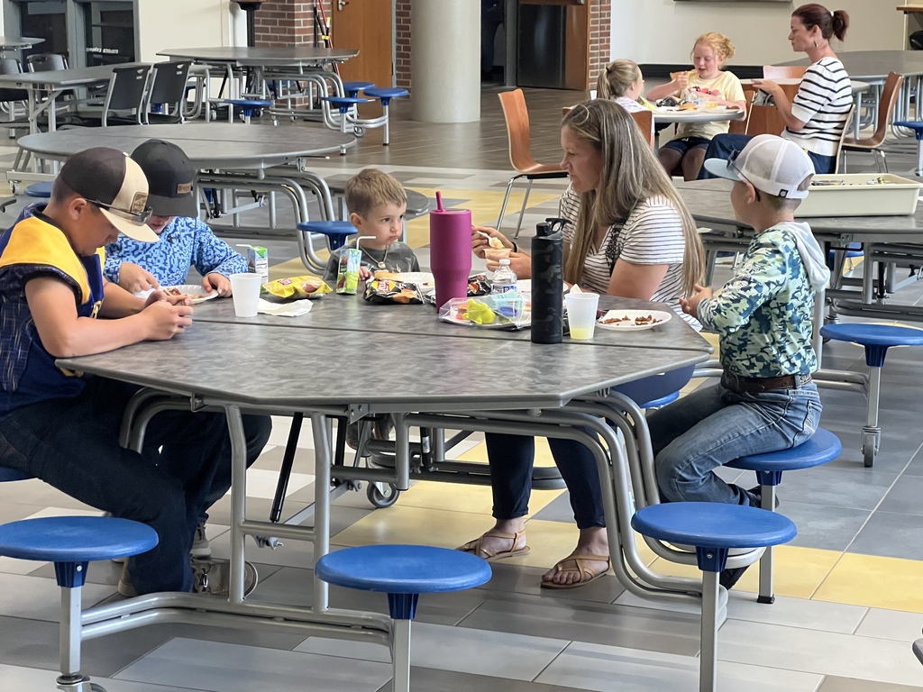 Families eating dinner.