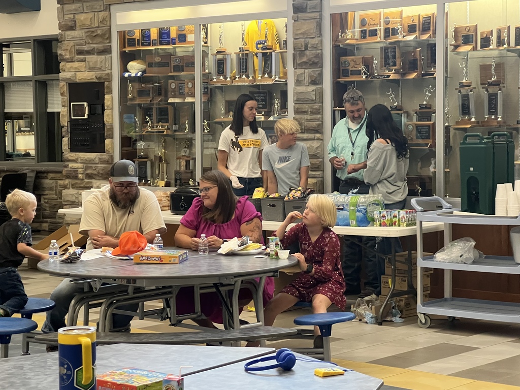 Families eating dinner.