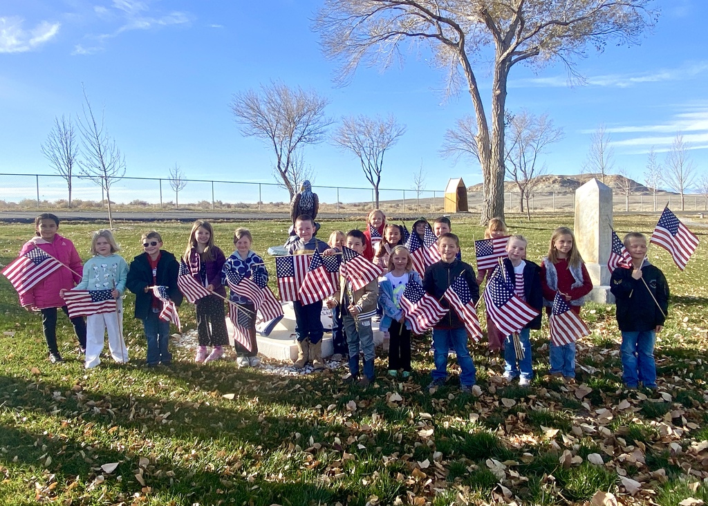 First Graders Honoring our local veterans at the Shoshoni Cemetery