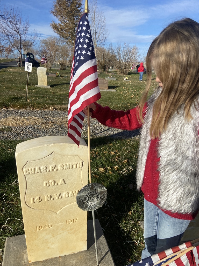 First Graders Honoring our local veterans at the Shoshoni Cemetery