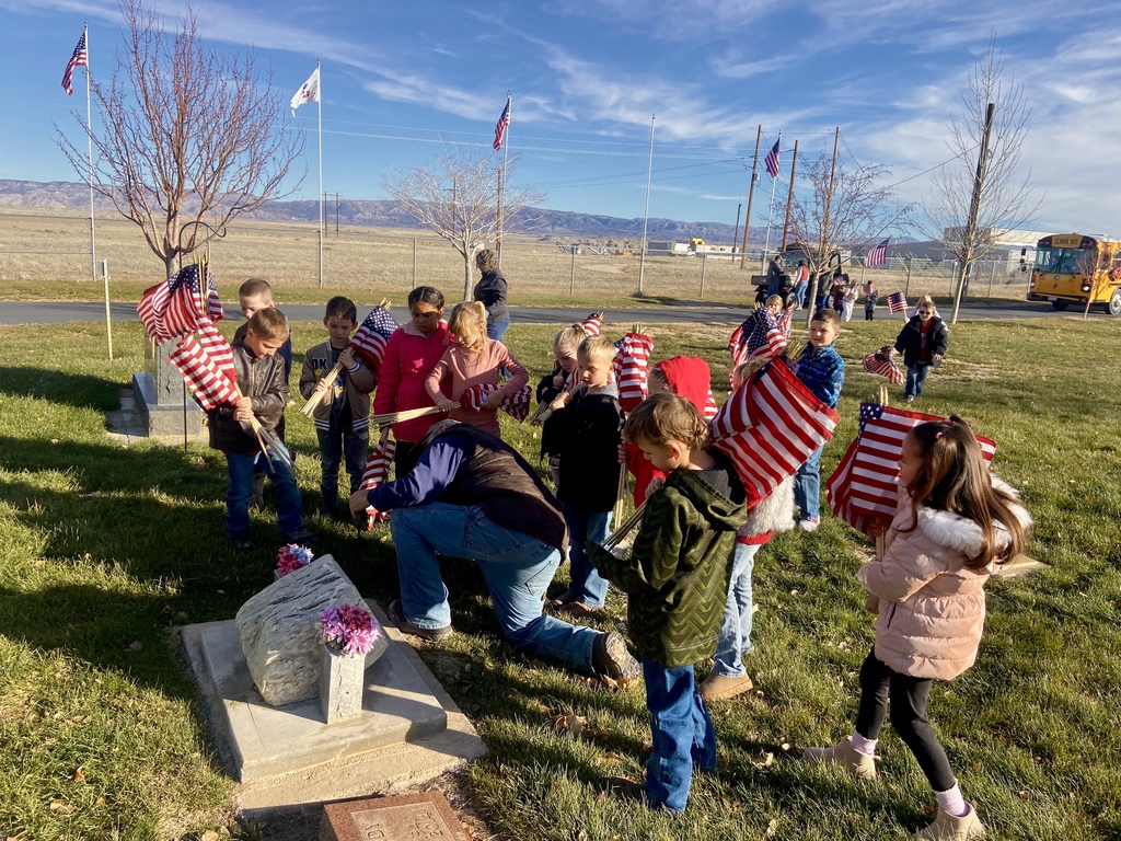 First Graders Honoring our local veterans at the Shoshoni Cemetery