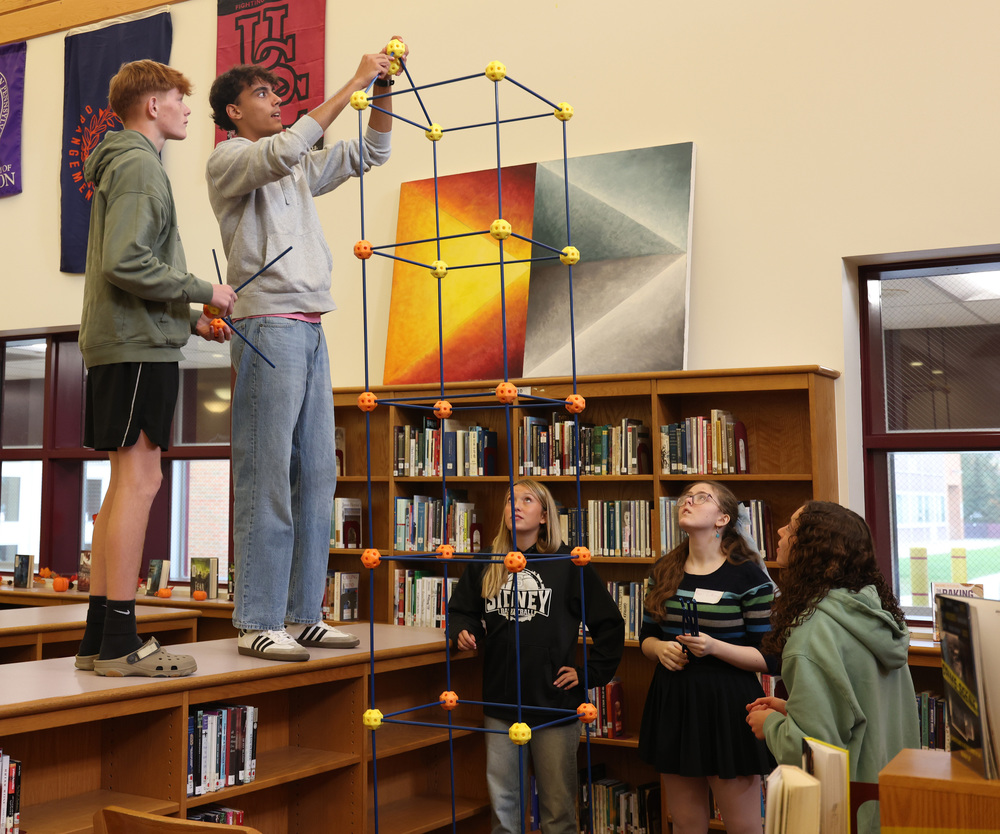 Students work together to try and build the tallest structure