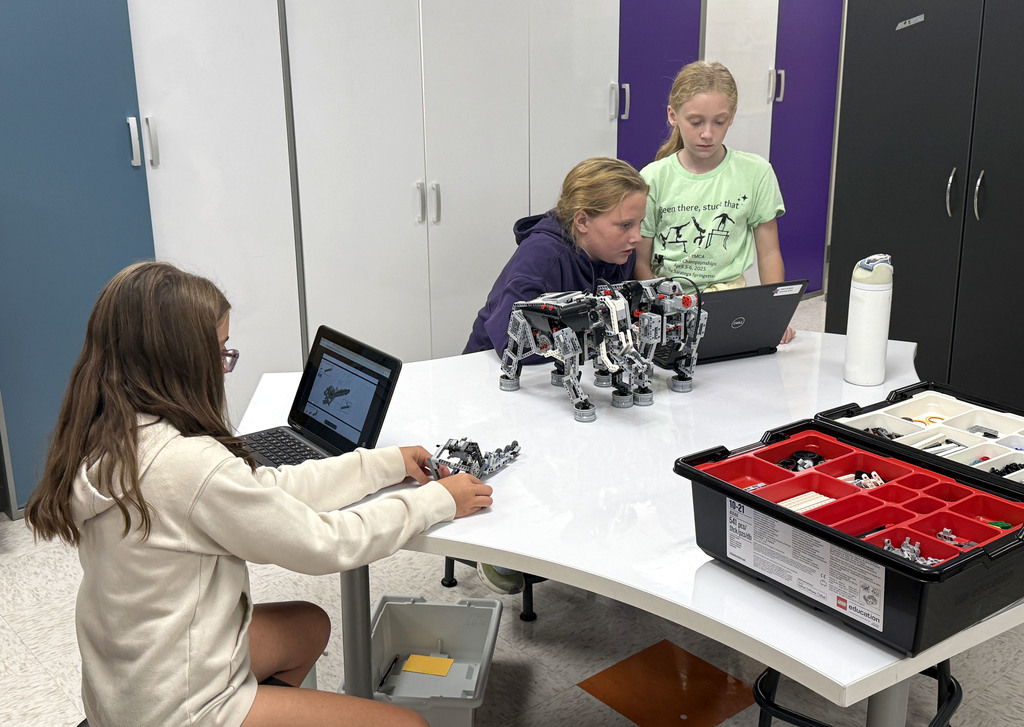 Three students who are working on an independent study in STEM/robotics