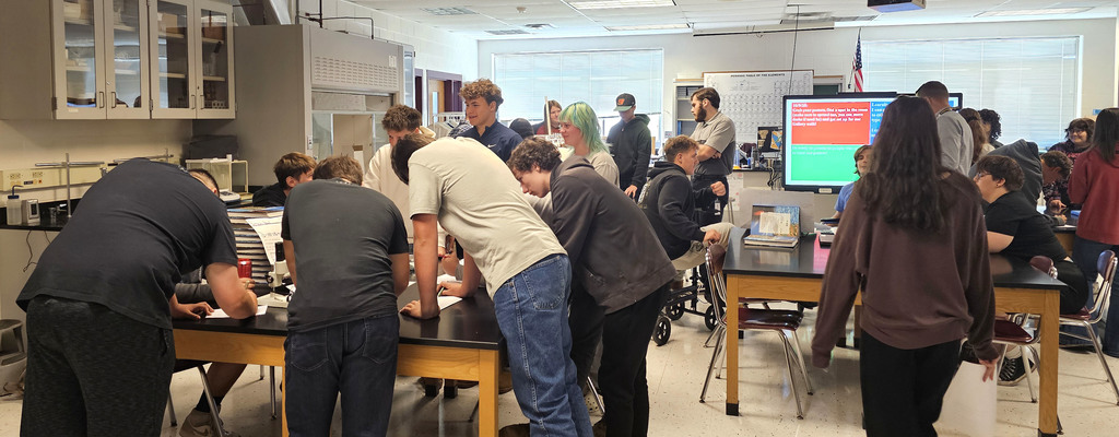 Students showing off their findings in physical science class.