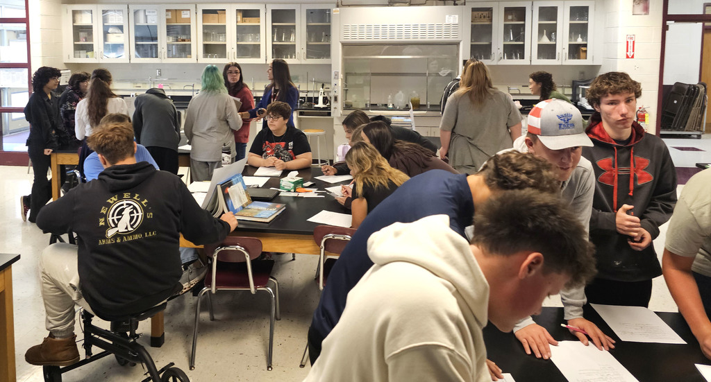 Students showing off their findings in physical science class.