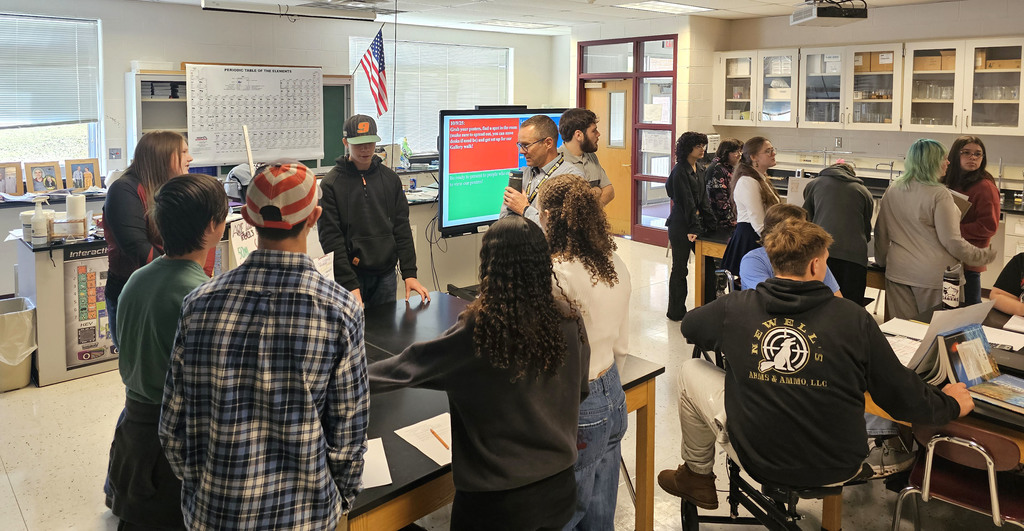 Students showing off their findings in physical science class.