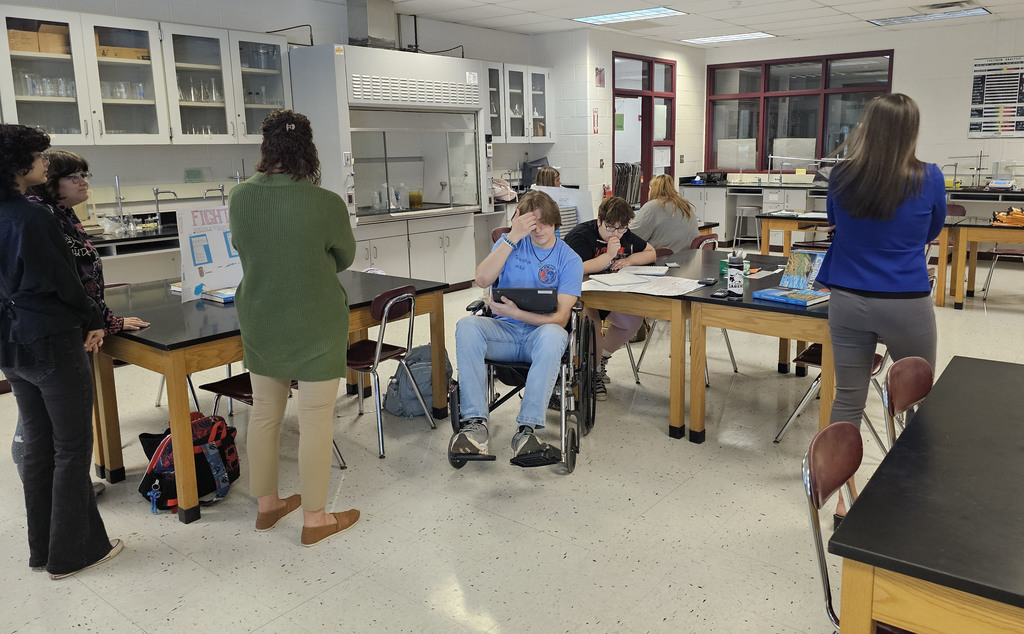 Students showing off their findings in physical science class.