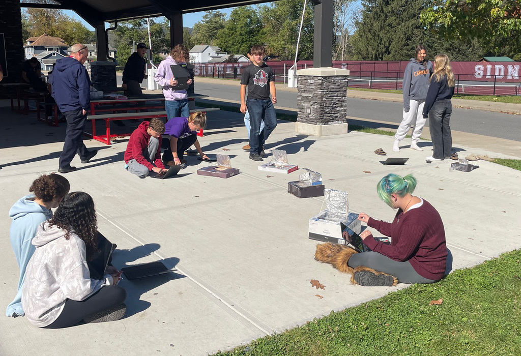 Students working on their solar oven project. 