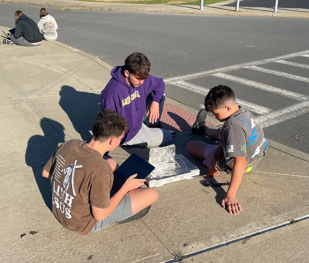 Students working on their solar oven project. 