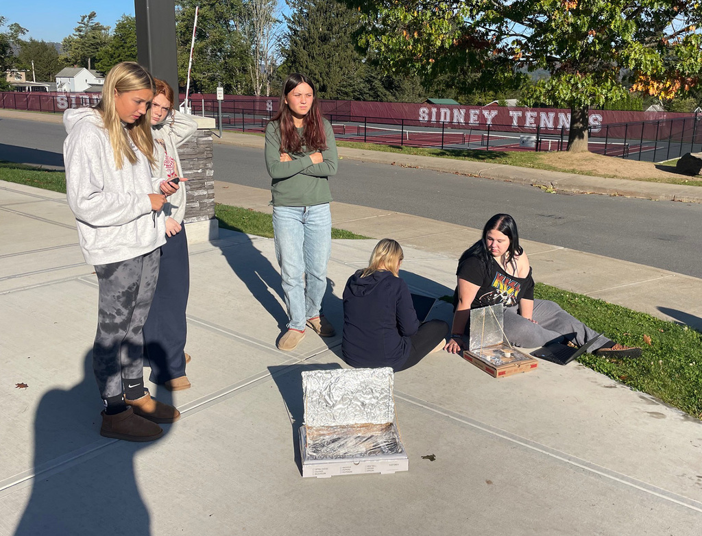 Students working on their solar oven project. 