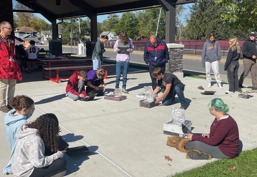 Students working on their solar oven project. 