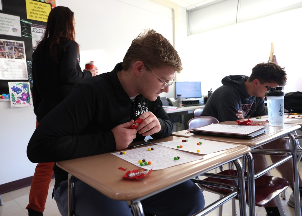 Students working in personal finance class 