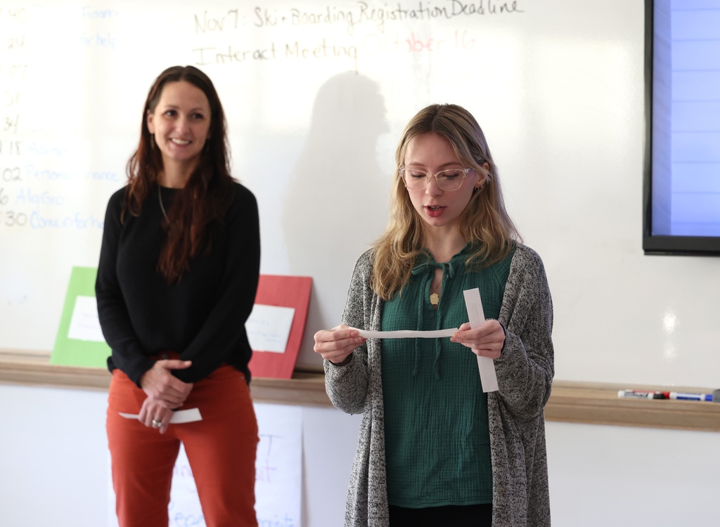 Students working in personal finance class 