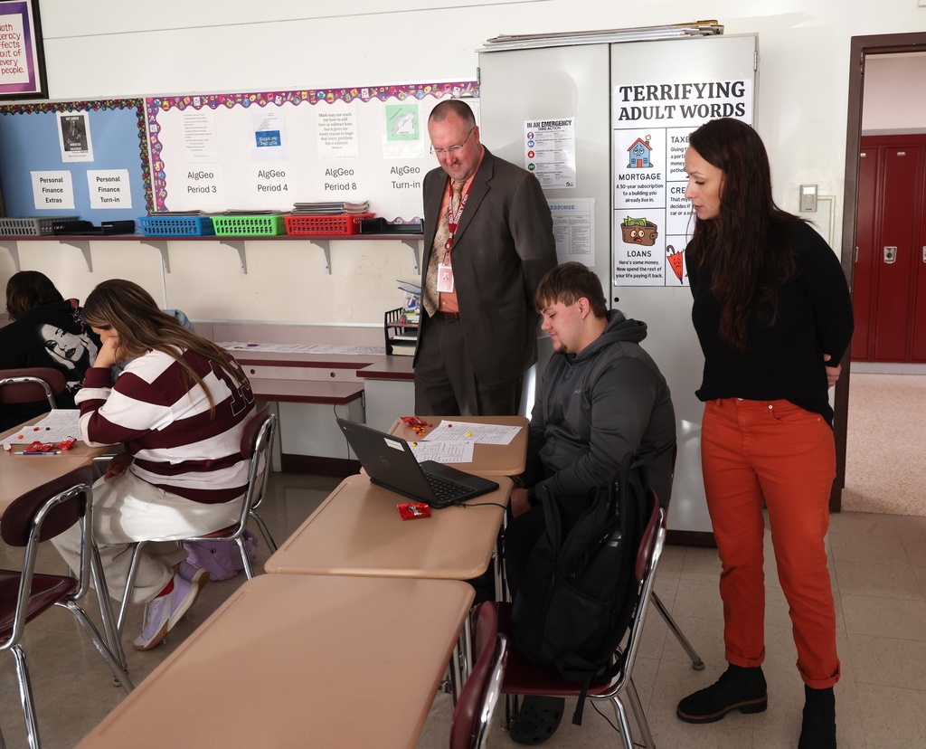 Students working in personal finance class 