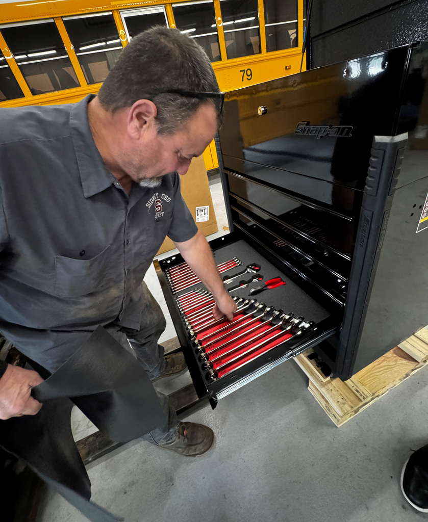 Mark Hotaling looks over some of the new tools