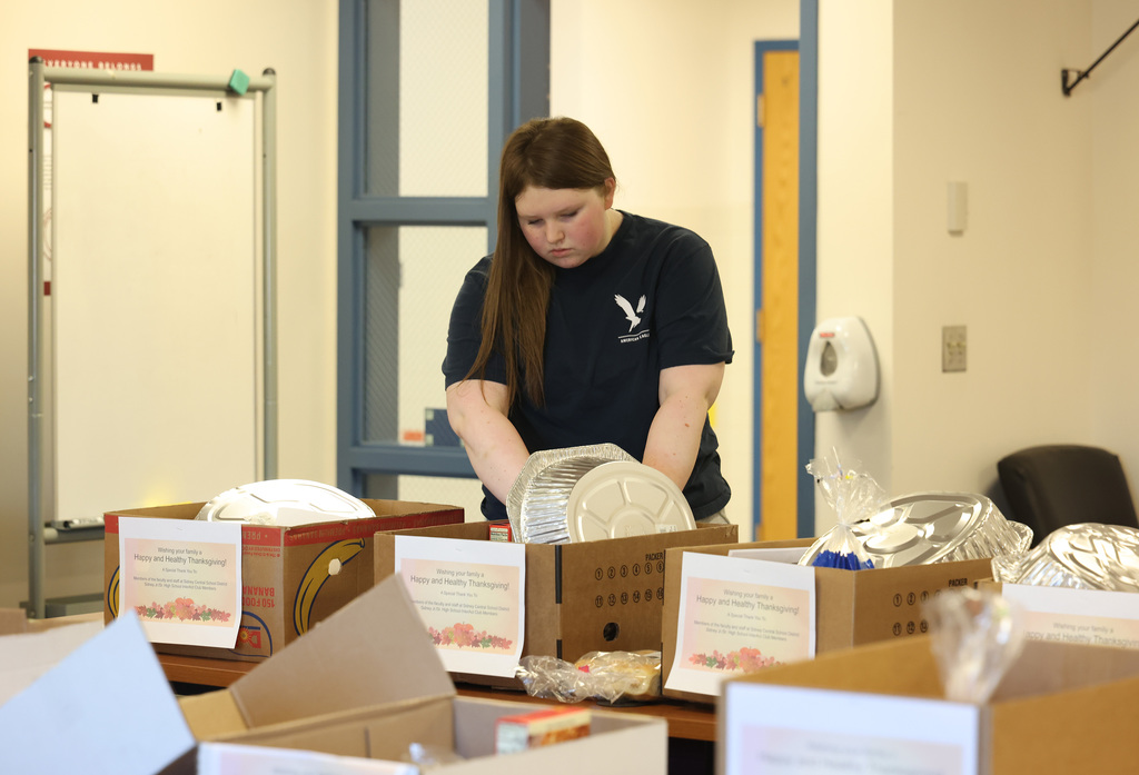 InterAct students helping pack Thanksgiving Day boxes.