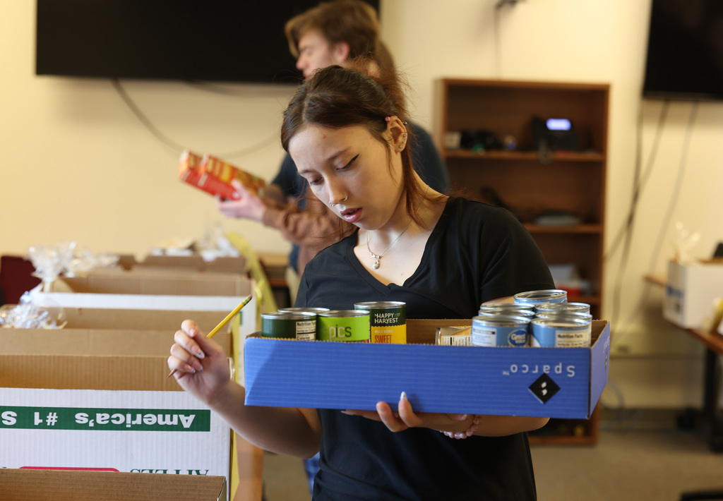InterAct students helping pack Thanksgiving Day boxes.
