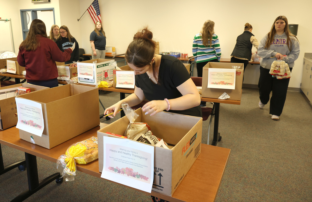 InterAct students helping pack Thanksgiving Day boxes.