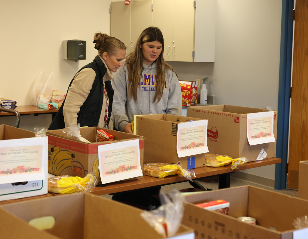InterAct students helping pack Thanksgiving Day boxes.