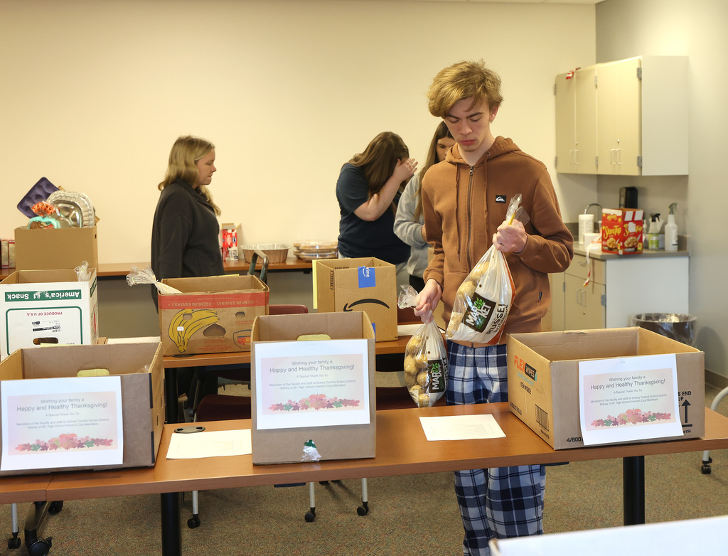 InterAct students helping pack Thanksgiving Day boxes.