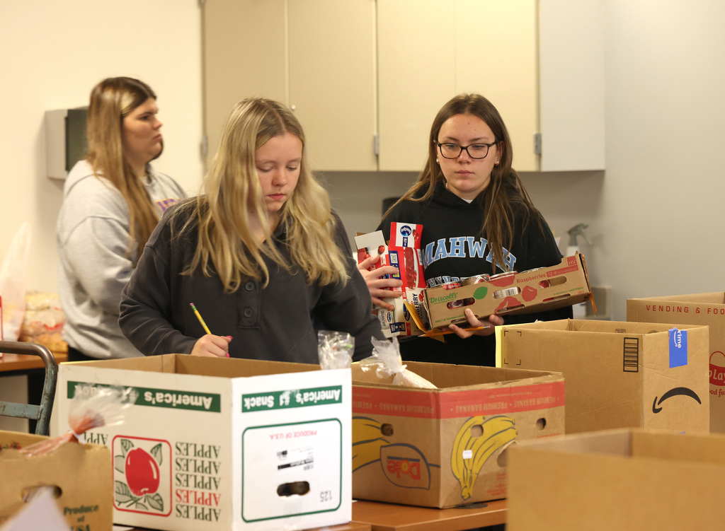 InterAct students helping pack Thanksgiving Day boxes.