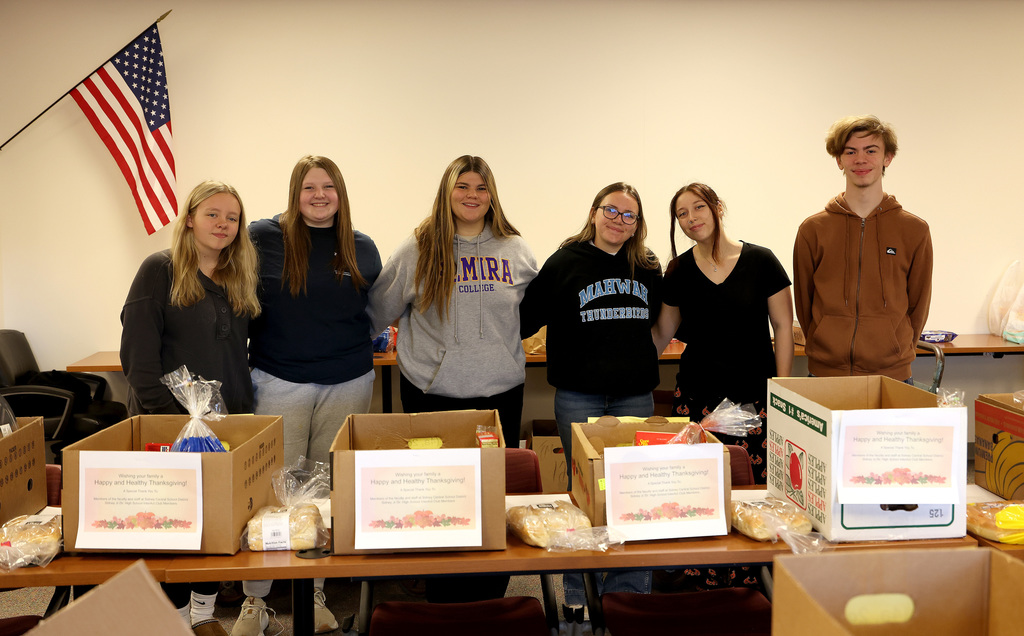 InterAct students helping pack Thanksgiving Day boxes.