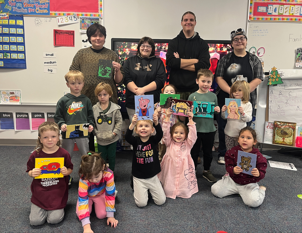 Painting class students with UPK students and their artwork