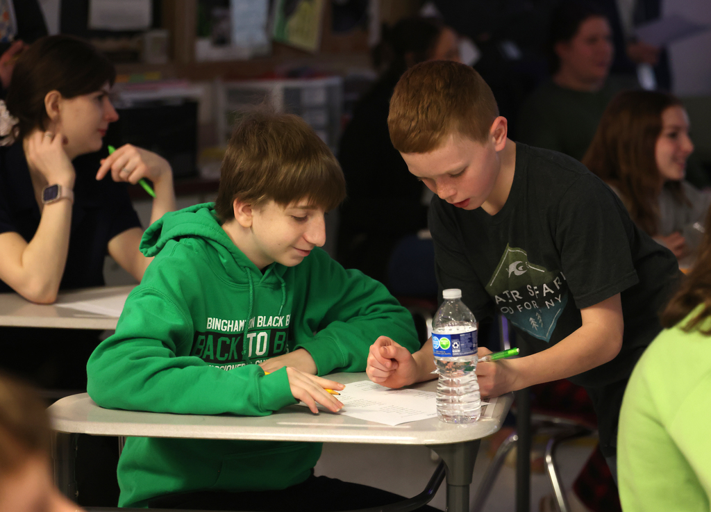 Students learning the Read Like Us strategy on Friday