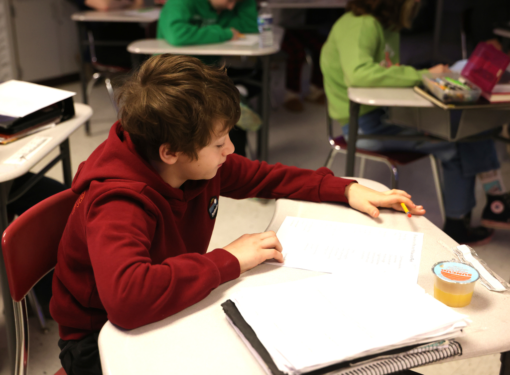 Students learning the Read Like Us strategy on Friday