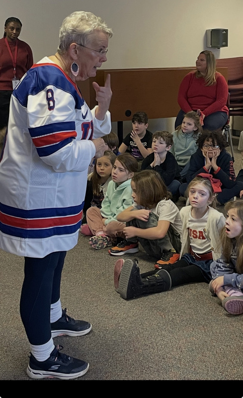 Mrs. Winn talking to students
