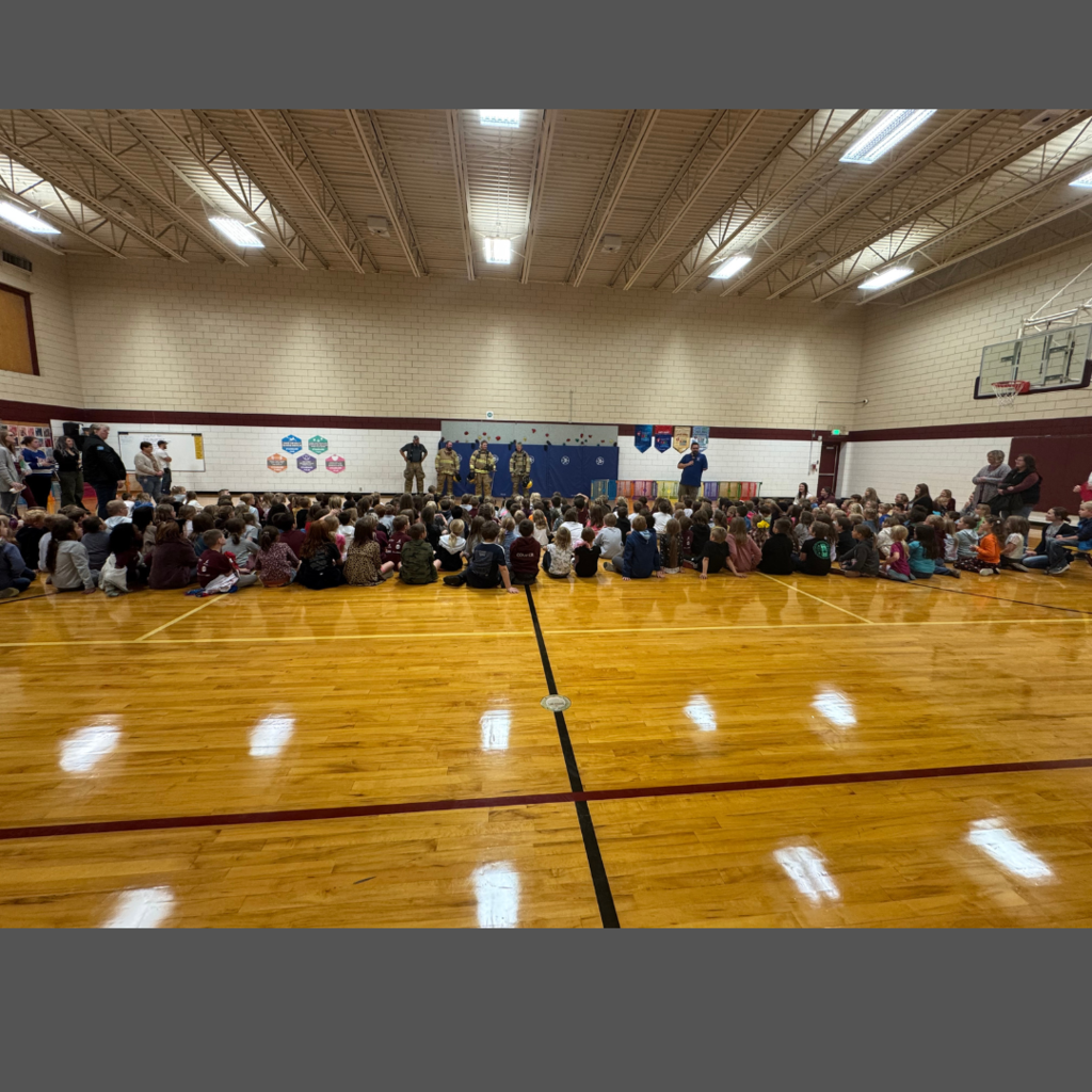 students at the fireman assembly with the firefighters and fire marshal