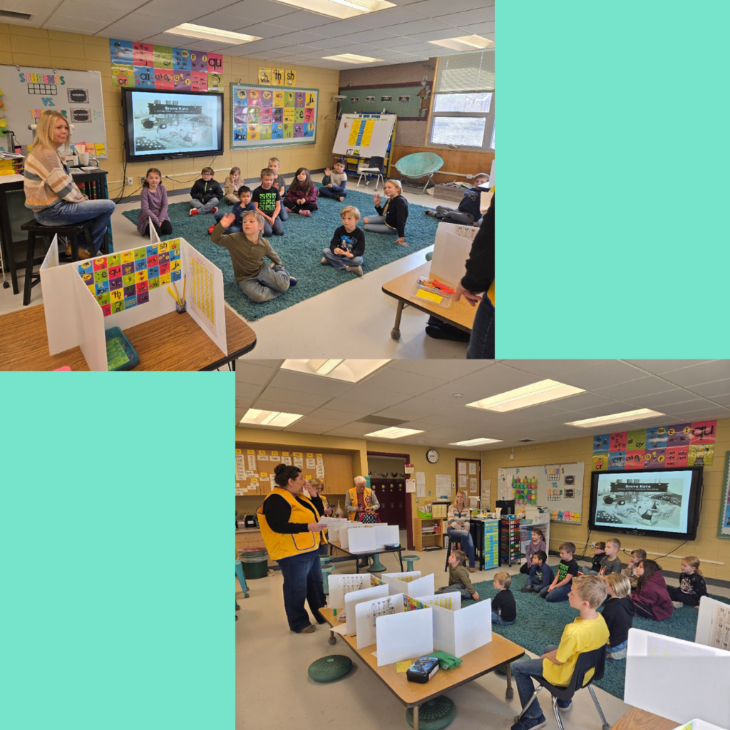 Lions club members handing out flags and talking to our first graders