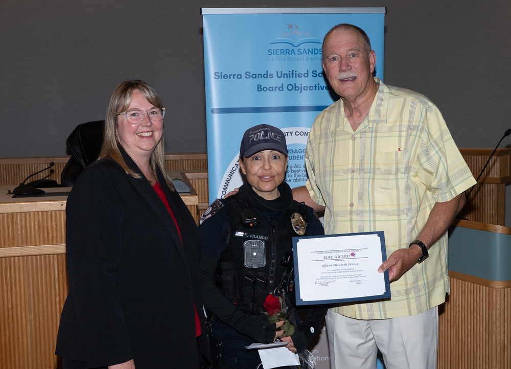 Officer Franco with Superintendent Moore and President Campbell