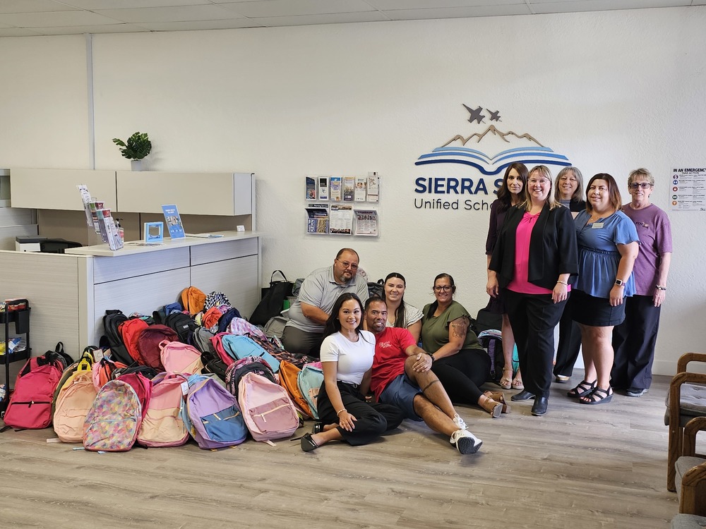 JT4 donates backpacks for students