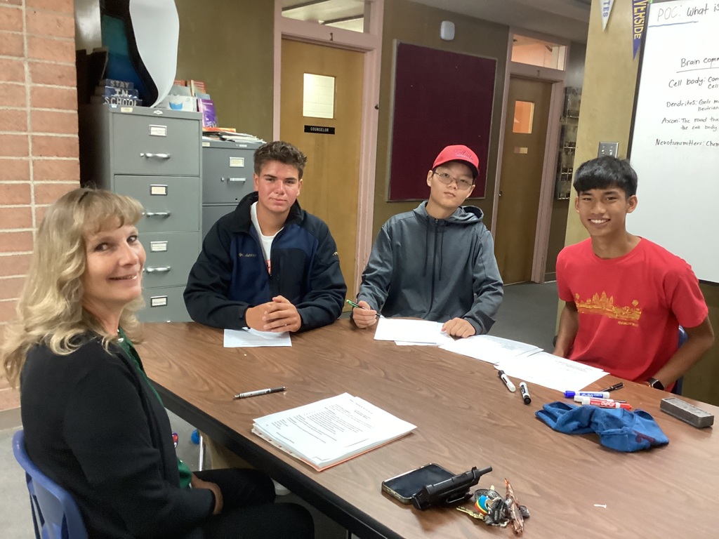 Principal Cope and students during a mock interview