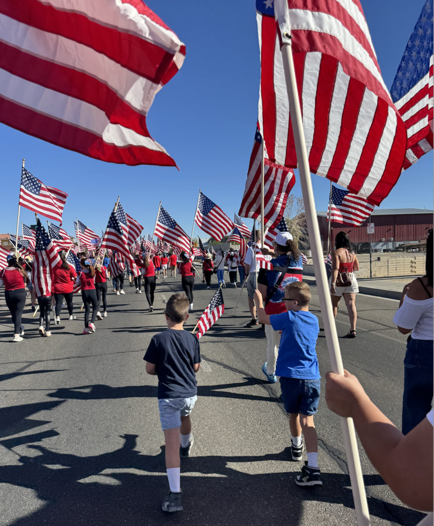 Students carrying flags in the parade