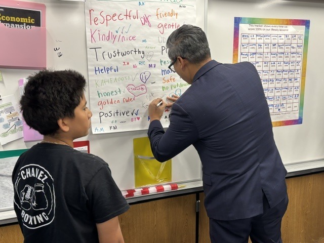 Congressman Vince Fong signing a social contract
