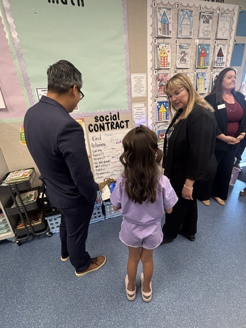 Congressman Vince Fong, Dr, Moore listening to a student discuss their social contract.