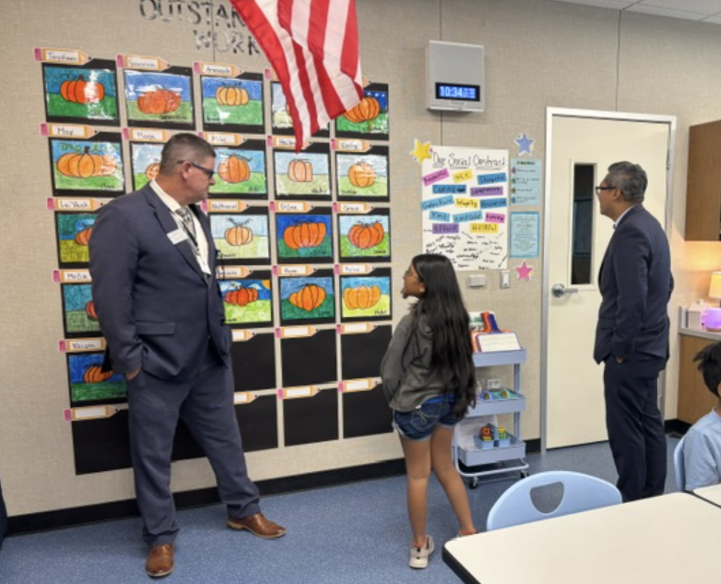 Congressman Vince Fong and Assistant Superintendent of Human Resources Bryan Auld listening to a student discuss their social contract.