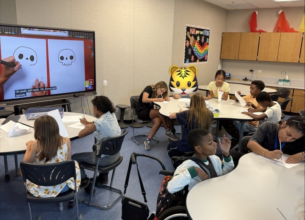 Fifth graders working on art