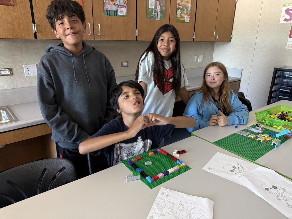 Fifth graders working on legos