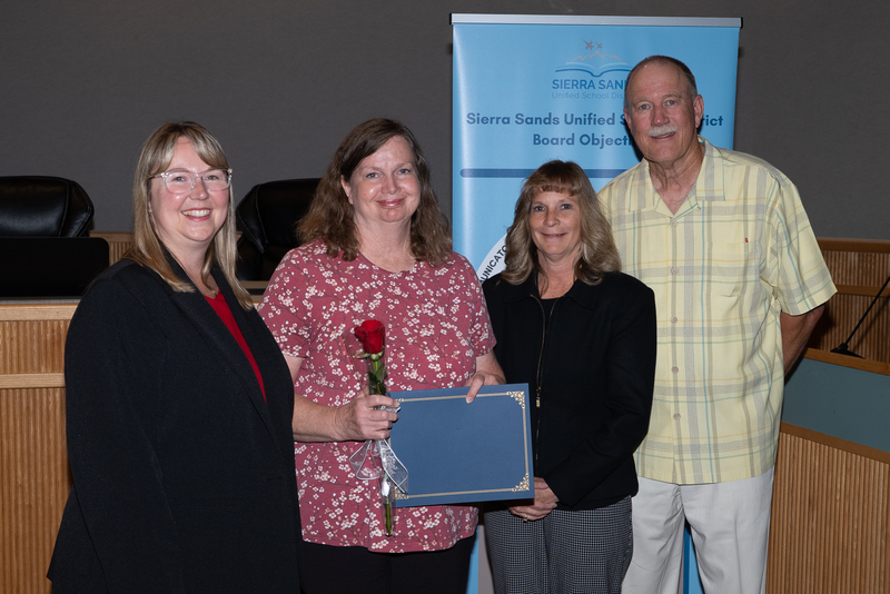 Diane Wonnacott with Principal Cope, Superintendent Moore, and President Campbell
