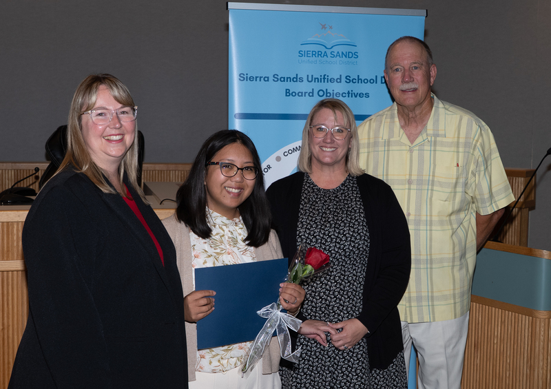 Catalina Connell with Assistant Principal Benadom, Superintendent Moore, and President Campbell