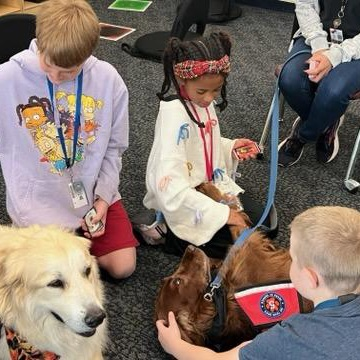 Village Meadows students got a visit from the therapy dogs!