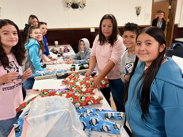 PDS StuCo wrapping gifts for Kiwanis Stocking Stuffer program.