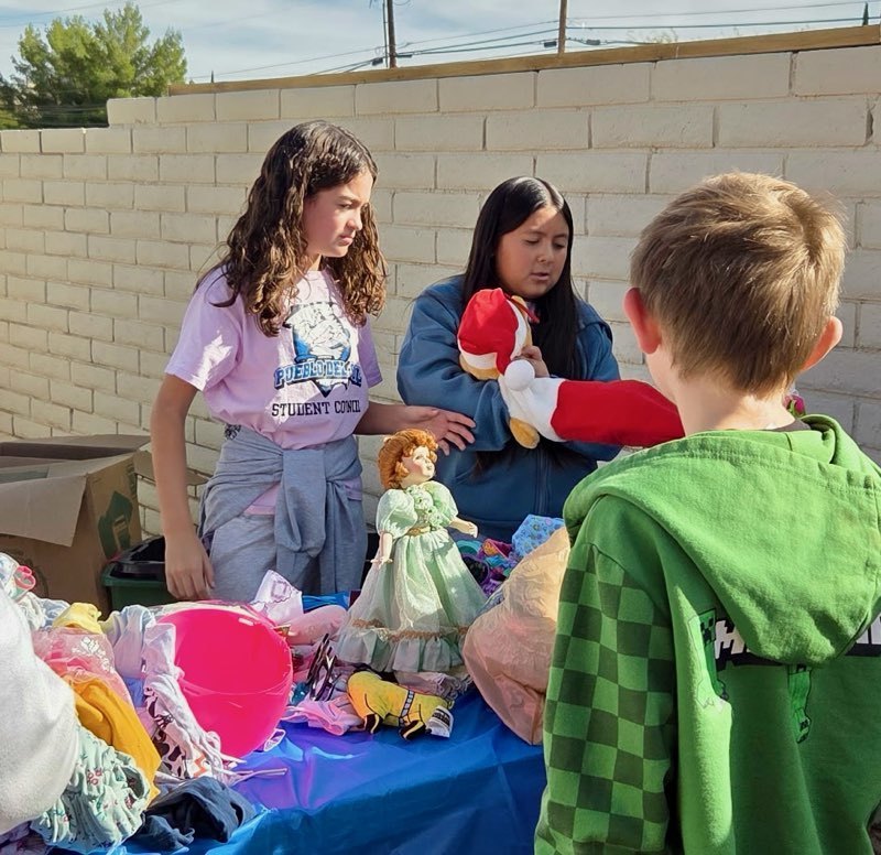 PDS StuCo at Santa on the West End passing out gifts to families in their community. 
