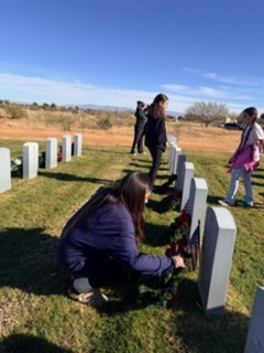 Students placing wreaths on the graves of our fallen soldiers. 