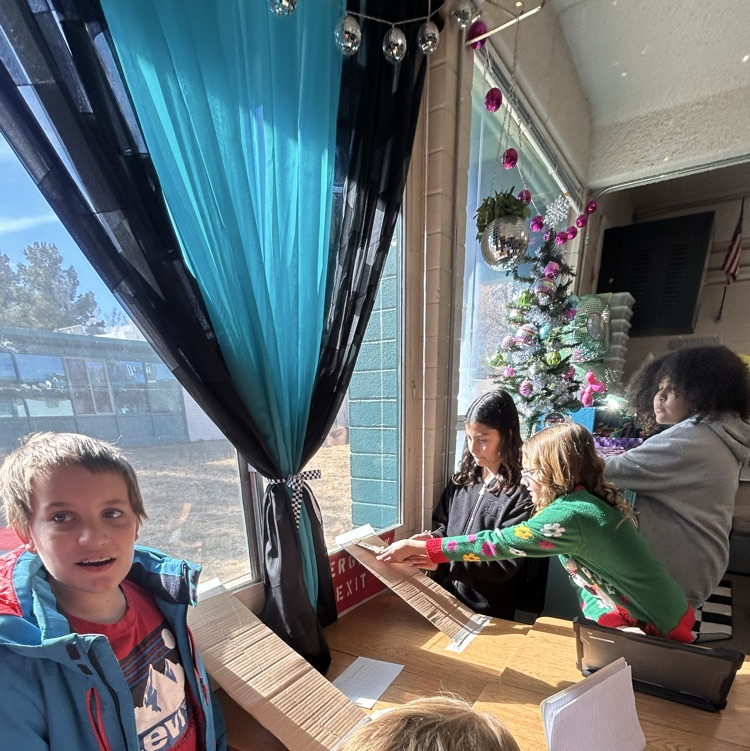 5th grade students testing different variables to create less friction.